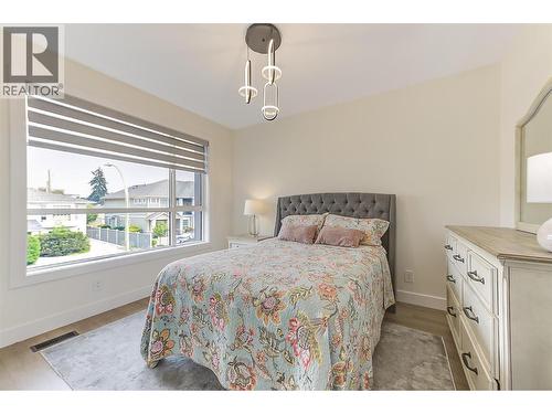 Bright primary bedroom with a clean, contemporary design and excellent natural light - 747 Patterson Avenue Unit# 2, Kelowna, BC - Indoor Photo Showing Bedroom