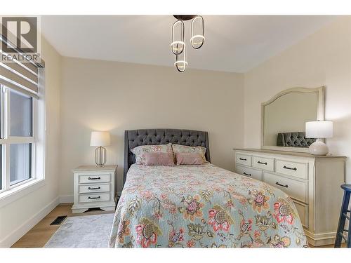 Primary suite with walk-through closet - 747 Patterson Avenue Unit# 2, Kelowna, BC - Indoor Photo Showing Bedroom