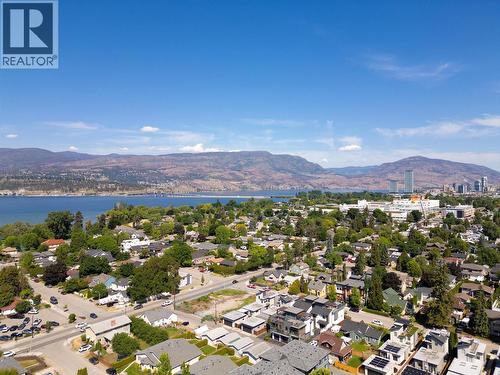 Aerial perspective showcasing the home’s location near Okanagan Lake and the heart of Kelowna - 747 Patterson Avenue Unit# 2, Kelowna, BC - Outdoor With Body Of Water With View