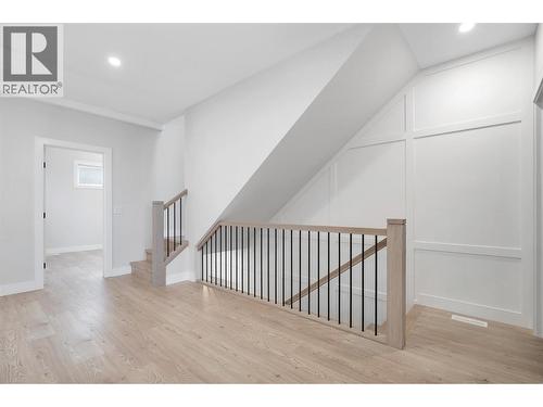 Feature Staircase - 1839 Grey Owl Court, Kelowna, BC - Indoor Photo Showing Other Room