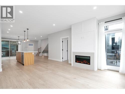 1839 Grey Owl Court, Kelowna, BC - Indoor Photo Showing Living Room With Fireplace