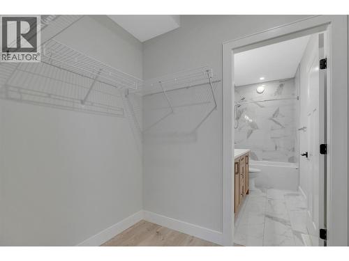Primary Closet and Bathroom - 1839 Grey Owl Court, Kelowna, BC - Indoor