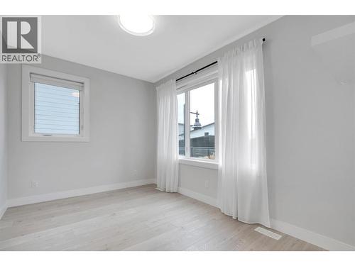 Upstairs Front Bedroom - 1839 Grey Owl Court, Kelowna, BC - Indoor Photo Showing Other Room