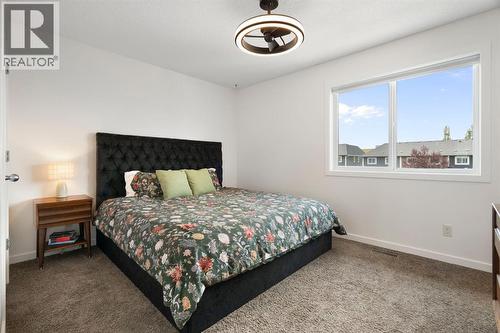 12 Fireside Burrow, Cochrane, AB - Indoor Photo Showing Bedroom