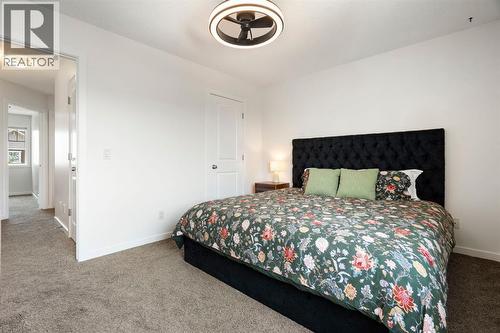 12 Fireside Burrow, Cochrane, AB - Indoor Photo Showing Bedroom