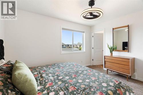 12 Fireside Burrow, Cochrane, AB - Indoor Photo Showing Bedroom