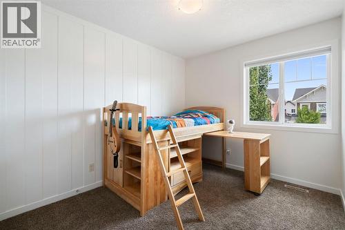 12 Fireside Burrow, Cochrane, AB - Indoor Photo Showing Bedroom
