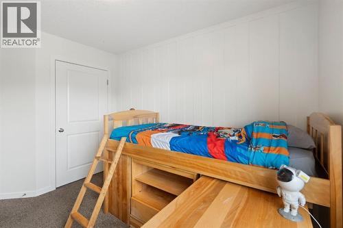 12 Fireside Burrow, Cochrane, AB - Indoor Photo Showing Bedroom