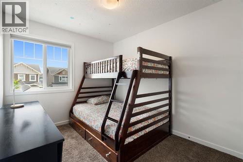 12 Fireside Burrow, Cochrane, AB - Indoor Photo Showing Bedroom