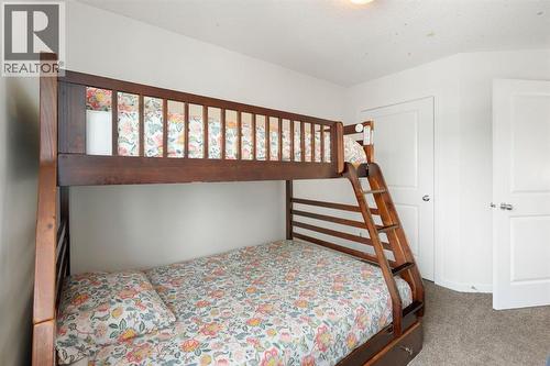 12 Fireside Burrow, Cochrane, AB - Indoor Photo Showing Bedroom