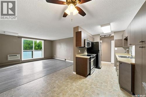 23 111 St Lawrence Crescent, Saskatoon, SK - Indoor Photo Showing Kitchen With Double Sink