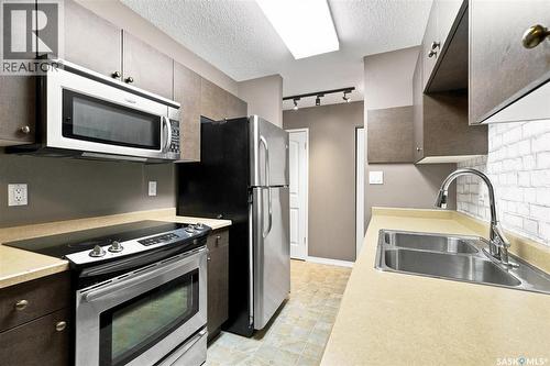 23 111 St Lawrence Crescent, Saskatoon, SK - Indoor Photo Showing Kitchen With Stainless Steel Kitchen With Double Sink