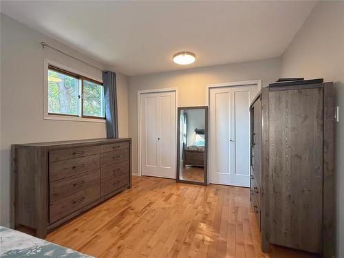 His & Hers Closets - 115 Mcvicar Crescent, Brandon, MB - Indoor Photo Showing Bedroom