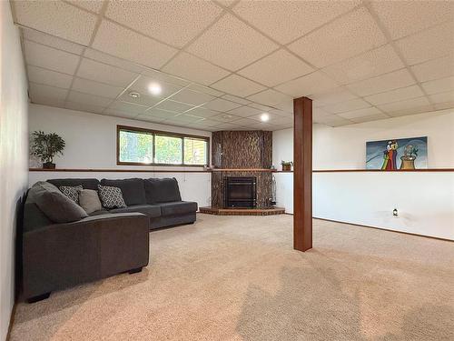 Wood Burning Fireplace for those chilly nights - 115 Mcvicar Crescent, Brandon, MB - Indoor With Fireplace