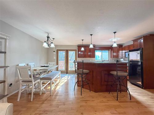 Garden Doors onto Deck - 115 Mcvicar Crescent, Brandon, MB - Indoor Photo Showing Dining Room