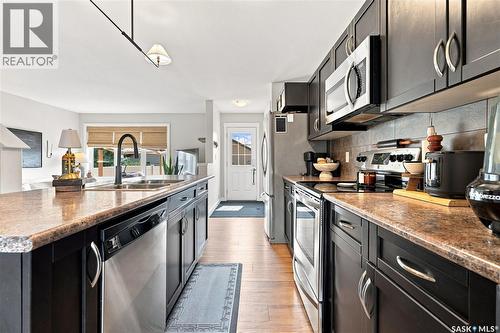 4409 Green Poplar Lane E, Regina, SK - Indoor Photo Showing Kitchen With Stainless Steel Kitchen With Double Sink With Upgraded Kitchen