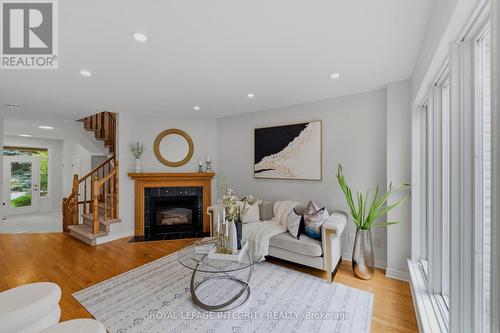 Living Room - Main Level - 20 Redding Way, Ottawa, ON - Indoor Photo Showing Living Room With Fireplace