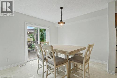 Sliding glass door to rear yard/outdoor patio area - 568 Robert Ferrie Drive, Kitchener, ON - Indoor Photo Showing Dining Room