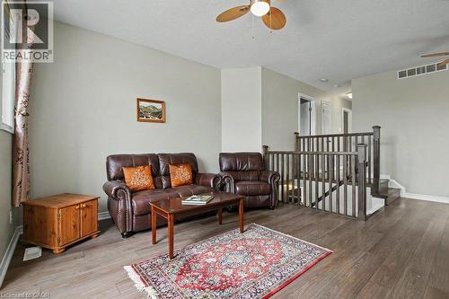 Wood flooring, staircase with wood railing - 568 Robert Ferrie Drive, Kitchener, ON - Indoor