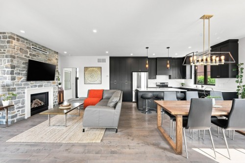 Overall view - 48 Boul. Des Mésanges, Saint-Charles-Borromée, QC - Indoor With Fireplace