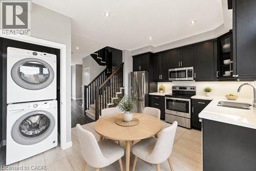 Virtually Staged - 1169 Garner Road E Unit# 86, Hamilton, ON - Indoor Photo Showing Laundry Room