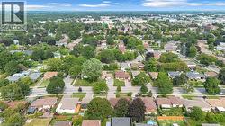 Expansive residential area featuring numerous detached homes and mature trees - 