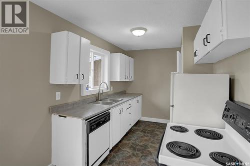 34 Armstrong Bay, Regina, SK - Indoor Photo Showing Kitchen With Double Sink