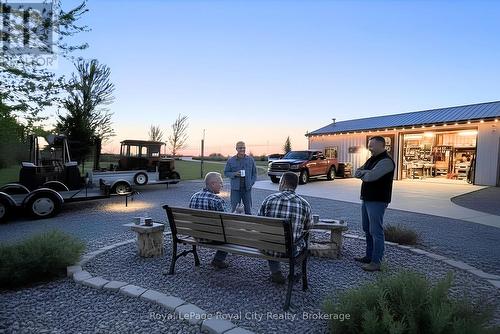 Virtually staged outside of workshop evening view - 7793 Sideroad 8 Side Road E, Wellington North, ON 