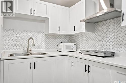 207 Kolynchuk Manor, Saskatoon, SK - Indoor Photo Showing Kitchen With Double Sink
