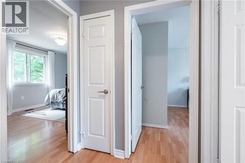 Light wood-finish flooring with white trim - 152 Concession 7 Road E, Millgrove, ON - Indoor Photo Showing Other Room
