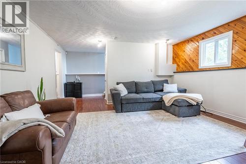 Wood-finish flooring, white walls, and a recessed window with wood-paneled detailing - 152 Concession 7 Road E, Millgrove, ON - Indoor Photo Showing Living Room
