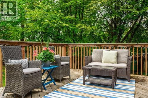 Expansive wood-finish deck with a wood-slat railing, surrounded by mature trees - 152 Concession 7 Road E, Millgrove, ON - Outdoor With Deck Patio Veranda With Exterior
