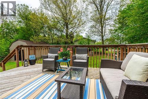 Expansive outdoor deck with a wooden railing system, featuring a dedicated storage shed, and a lush green lawn - 152 Concession 7 Road E, Millgrove, ON - Outdoor With Deck Patio Veranda With Exterior