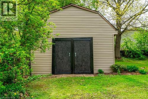Gable roof shed featuring horizontal siding and double black doors - 152 Concession 7 Road E, Millgrove, ON - Outdoor