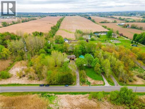 Expansive property featuring multiple driveways, mature trees, open green spaces, and a visible pond - 152 Concession 7 Road E, Millgrove, ON - Outdoor With View