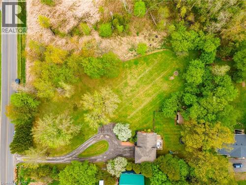 Expansive property featuring a circular driveway, substantial green spaces, mature trees, and a treehouse structure - 152 Concession 7 Road E, Millgrove, ON - Outdoor With View