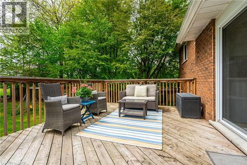 Expansive wood deck with a wood railing, brick exterior, and white sliding glass door - 152 Concession 7 Road E, Millgrove, ON - Outdoor With Deck Patio Veranda With Exterior