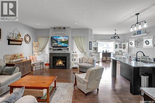 5471 Universal Crescent, Regina, SK - Indoor Photo Showing Living Room With Fireplace