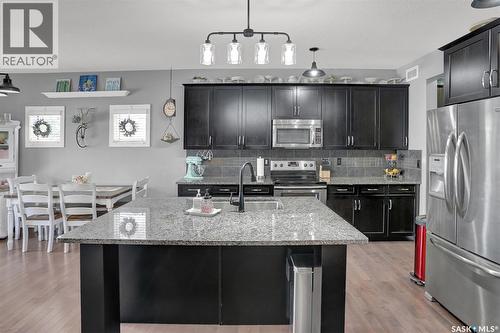 5471 Universal Crescent, Regina, SK - Indoor Photo Showing Kitchen With Stainless Steel Kitchen With Double Sink With Upgraded Kitchen