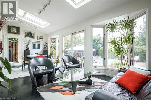 Multiple skylights and track lighting illuminate the interior - 107 Bond Street S, Hamilton, ON - Indoor