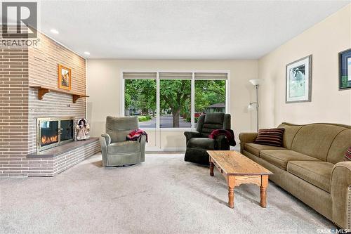 220 Frontenac Drive, Regina, SK - Indoor Photo Showing Living Room With Fireplace