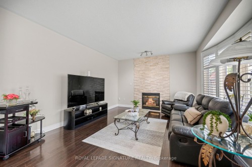 7134 Hallsands Drive, Mississauga, ON - Indoor Photo Showing Living Room With Fireplace