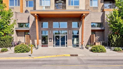 306-1550 Dickson Avenue, Kelowna, BC - Outdoor With Balcony With Facade