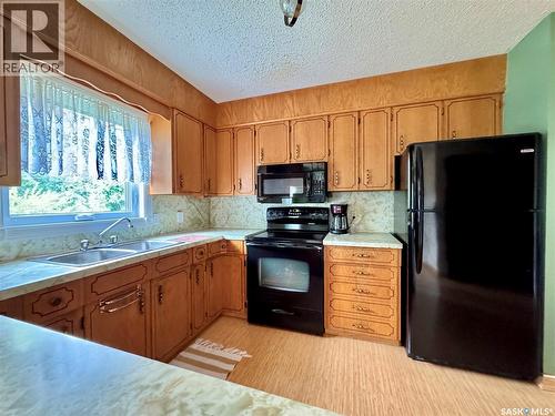 100 Henderson Street, Grayson, SK - Indoor Photo Showing Kitchen With Double Sink