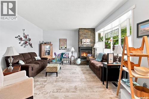 2 Springstein Avenue, Regina, SK - Indoor Photo Showing Living Room With Fireplace