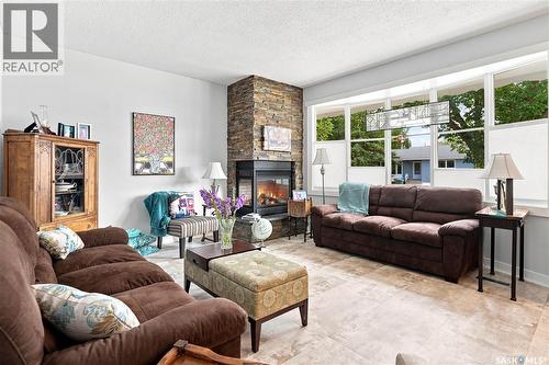 2 Springstein Avenue, Regina, SK - Indoor Photo Showing Living Room With Fireplace