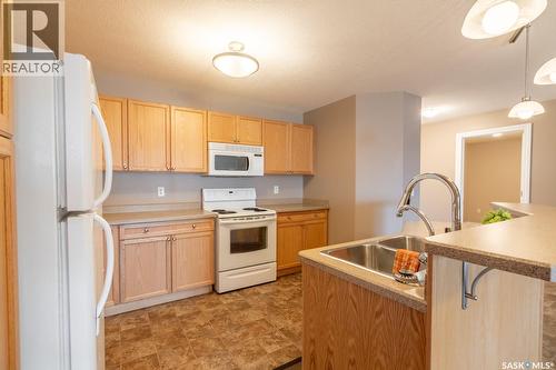108 6345 Rochdale Boulevard, Regina, SK - Indoor Photo Showing Kitchen With Double Sink