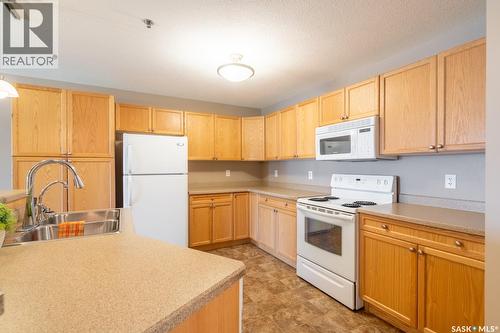 108 6345 Rochdale Boulevard, Regina, SK - Indoor Photo Showing Kitchen With Double Sink