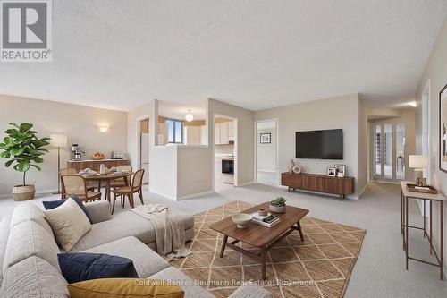 Virtually Staged - 708 - 22 Marilyn Drive, Guelph (Riverside Park), ON - Indoor Photo Showing Living Room