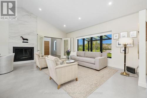 4566 Harwood Road, Hamilton Township, ON - Indoor Photo Showing Living Room With Fireplace